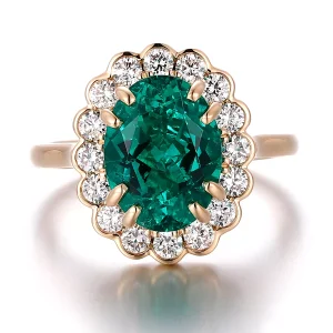 Emerald surround oval ring